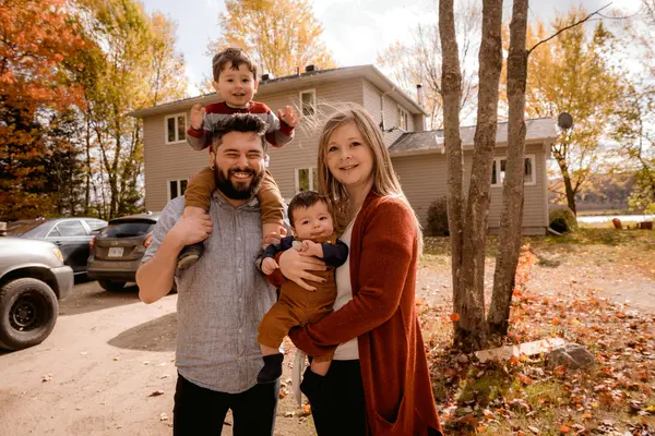 Family in front of their painted home